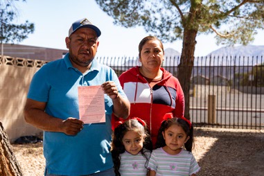 Street vendors Humberto and Mariana are pictured with their twin daughters near a grade school at Riata Way and Copper Road, April 10, 2022. An agent from the Clark County Department of Business Licensing served the couple with a citation for conducting business on the public right of way, marking the first time they’ve been cited in nearly a decade of doing business in mostly the same location, they said.