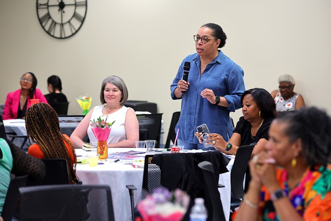 UNLV School of Nursing professor Melva Thompson-Robinson asks a question about Senate Bill 232, which extends postpartum Medicaid coverage from 60 days to a full year, during a Black Maternal Health Panel Discussion at the Doolittle Senior Center Wednesday, April 17, 2024. The event was part of Black Maternal Health Week and promoted by the Biden-Harris campaign.
