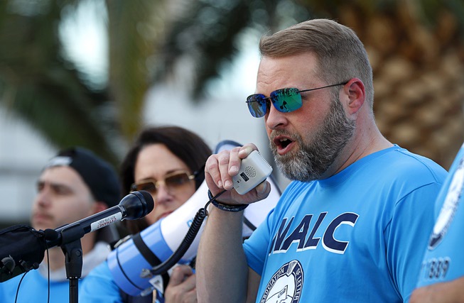Brian Renfroe, national president of the National Association of Letter Carriers (NALC), speaks during a demonstration by letter carriers in front of the Lloyd George Federal Building in downtown Las Vegas Wednesday, April 17, 2024.
