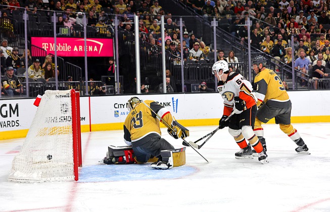 A puck shot by Anaheim Ducks right wing Frank Vatrano (77) gets past Vegas Golden Knights goaltender Adin Hill (33) during the second period of an NHL hockey game at T-Mobile Arena Thursday, April 18, 2024.