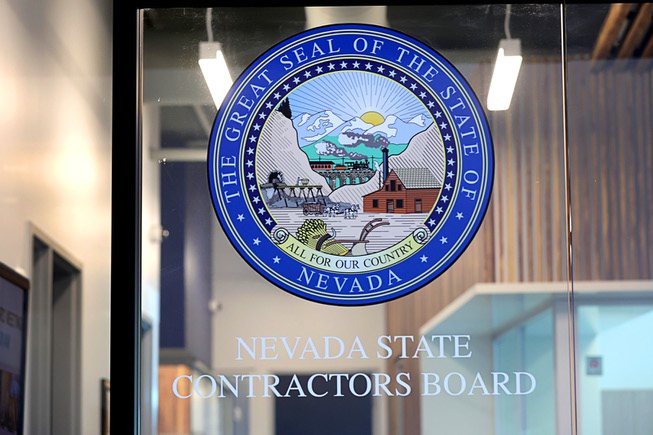 A view of the Nevada state seal on the doors of the Nevada State Contractors Board office Friday, April 19, 2024.