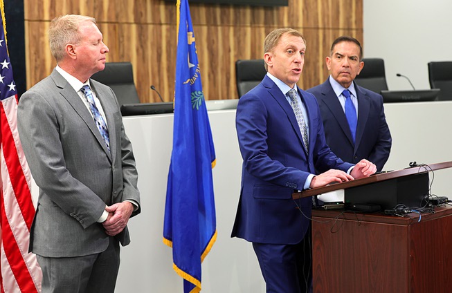 David Behar, center, deputy executive officer with the Nevada State Contractors Board, responds to a question during a news conference at the Contractors Board office Friday, April 19, 2024. Also pictured are Terry Wike, left, director of investigations, and Randy Escamilla, public information officer. Officials announced the arrest of Guadalupe Derek Carbajal, general manager of Lifetime Power, who is accused of collecting money for solar installations but not performing any work.