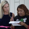 Amanda Zurawski, left, who developed sepsis and nearly died after being refused an abortion when her water broke at 18 weeks, and Samantha Casiano, who was forced to carry a nonviable pregnancy to term and gave birth to a baby who died four hours after birth, right, wait to talk to the media outside the Travis County Courthouse, Wednesday, July 19, 2023, in Austin, Texas. A Texas judge heard testimony from women who say they were told they could not end their pregnancies in Texas even though their lives and health were in danger.
