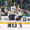 Vegas Golden Knights' Noah Hanifin (15) celebrates with Mark Stone (61), Tomas Hertl, front right, and Jack Eichel, left, after Stone scored in the first period in Game 1 of an NHL hockey Stanley Cup first-round playoff series against the Dallas Stars in Dallas, Monday, April 22, 2024. 
