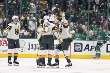 Vegas Golden Knights’ Noah Hanifin (15) celebrates with Mark Stone (61), Tomas Hertl, front right, and Jack Eichel, left, after Stone scored in the first period in Game 1 of an NHL hockey Stanley Cup first-round playoff series against the Dallas Stars in Dallas, Monday, April 22, 2024. 
