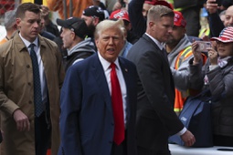 Former President Donald Trump reacts while meeting with construction workers at the construction site of the new JPMorgan Chase headquarters in midtown Manhattan, Thursday, April 25, 2024, in New York. Trump met with construction workers and union representatives hours before he's set to appear in court.