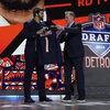 Southern California quarterback Caleb Williams celebrates with NFL commissioner Roger Goodell after being chosen by the Chicago Bears with the first overall pick during the first round of the NFL football draft, Thursday, April 25, 2024, in Detroit.

