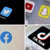 This combination of photos shows logos of Twitter, top left; Snapchat, top right; Facebook, bottom left; and TikTok. 