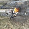 Afreight train carrying fuel derailed and caught fire, Friday, April 26, 2024, east of Lupton, Ariz., near the New Mexico-Arizona state line. Authorities closed Interstate 40 in both directions in the area, directing trucks and motorists to alternate routes. 