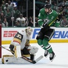 Vegas Golden Knights goaltender Adin Hill (33) blocks a shot under pressure from Dallas Stars left wing Jamie Benn (14) in the first period in Game 5 of an NHL hockey Stanley Cup first-round playoff series in Dallas, Wednesday, May 1, 2024. 
