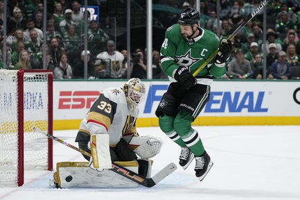 Vegas Golden Knights goaltender Adin Hill (33) blocks a shot under pressure from Dallas Stars left wing Jamie Benn (14) in the first period in Game 5 of an NHL hockey Stanley Cup first-round playoff series in Dallas, Wednesday, May 1, 2024. 