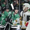 Dallas Stars' Logan Stankoven (11), Evgenii Dadonov, second from left, and Wyatt Johnston (53) celebrate a goal by Dadonov as Vegas Golden Knights' Jack Eichel (9) skates past in the first period in Game 5 of an NHL hockey Stanley Cup first-round playoff series in Dallas, Wednesday, May 1, 2024. 