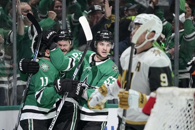 Dallas Stars’ Logan Stankoven (11), Evgenii Dadonov, second from left, and Wyatt Johnston (53) celebrate a goal by Dadonov as Vegas Golden Knights’ Jack Eichel (9) skates past in the first period in Game 5 of an NHL hockey Stanley Cup first-round playoff series in Dallas, Wednesday, May 1, 2024. 