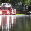 A Houston firetruck makes it way through flood water in North Woodland Hills after severe flooding, Thursday, May 2, 2024, in the Houston neighborhood of Kingwood, Texas.


