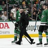 Dallas Stars' Tyler Seguin, left, is escorted off the ice by a staff member and Nils Lundkvist, after taking a hit to the face by Vegas Golden Knights' Alex Pietrangelo in the second period in Game 5 of an NHL hockey Stanley Cup first-round playoff series in Dallas, Wednesday, May 1, 2024. Pietrangelo recieved a penalty on the play. 