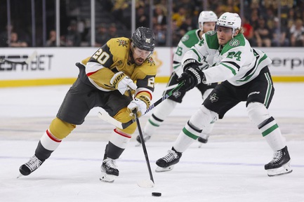 Vegas Golden Knights center Chandler Stephenson (20) chases after the puck against Dallas Stars center Roope Hintz (24) during the first period of Game 6 of an NHL hockey Stanley Cup first-round playoff series at T-Mobile arena Friday, May 3, 2024.