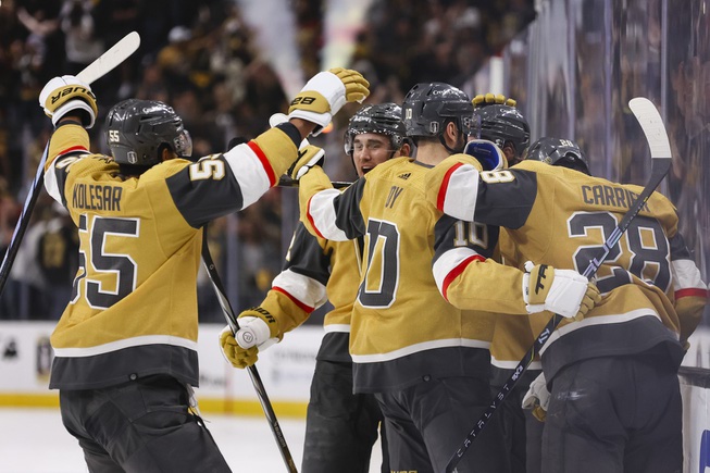 The Vegas Golden Knights celebrate after Noah Hanifin (15) scores against Dallas Stars goaltender Jake Oettinger (29) during the third period of Game 6 of an NHL hockey Stanley Cup first-round playoff series against the Dallas Stars at T-Mobile Arena Friday, May 3, 2024.
