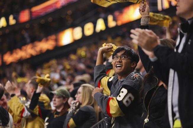 A Vegas Golden Knights fan celebrates during the third period of Game 6 of an NHL hockey Stanley Cup first-round playoff series against the Dallas Stars at T-Mobile Arena Friday, May 3, 2024.