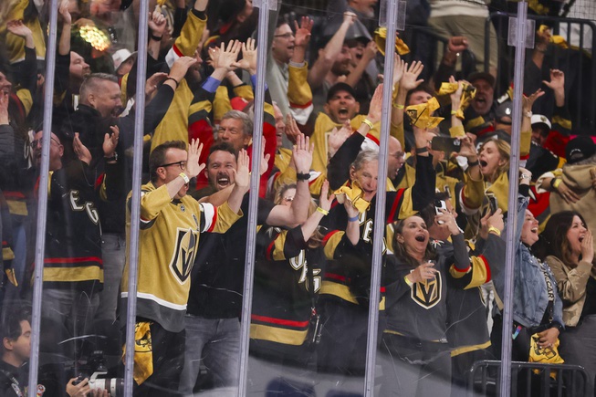 Vegas Golden Knights fans celebrate an empty net goal during the third period of Game 6 of an NHL hockey Stanley Cup first-round playoff series against the Dallas Stars at T-Mobile Arena Friday, May 3, 2024.
