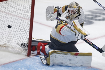 Vegas Golden Knights goaltender Adin Hill eyes the puck on a scoring shot by Dallas Stars center Radek Faksa during the third period in Game 7 of an NHL hockey Stanley Cup first-round playoff series, Sunday, May 5, 2024, in Dallas. 