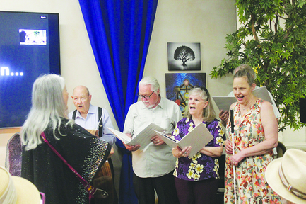 Members of the Las Vegas Interfaith Choir sing Saturday during the opening ceremony of the Interfaith Contemplative Center. The choir sang two songs with lyrics in English and Arabic.