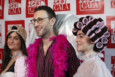 Debt Gala co-founders, from left, Molly Gaebe, Tom Costello and Amanda Corday, appear at the Debt Gala in the Brooklyn borough of New York on Sunday, May 5, 2024. Some 200 attendees sought to help alleviate medical debt at the second annual benefit, one of several alternative fundraisers that have popped up around the star-studded Met Gala. 


