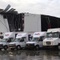 Photo: FedEx trucks sit outside a damaged FedEx facility 