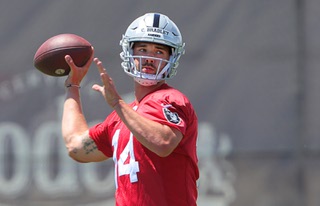 Las Vegas Raiders quarterback Carter Bradley  (14) passes during rookie minicamp at the Raiders Headquarters/Intermountain Health Performance Center in Henderson Friday, May 10, 2024.