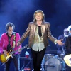 Mick Jagger, center, sings while flanked by Rolling Stones bandmates Ronnie Wood, left, and Keith Richards during the Stones’ "Hackney Diamonds Tour" stop at Allegiant Stadium Saturday, May 11, 2024,