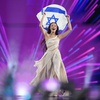 Eden Golan of Israel enters the arena during the flag parade before the Grand Final of the Eurovision Song Contest in Malmo, Sweden, Saturday, May 11, 2024. 