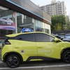 A Seagull electric vehicle from Chinese automaker BYD for test driving is parked outside a showroom in Beijing, Wednesday, April 10, 2024.