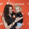 New York Liberty forward Breanna Stewart holds her daughter Ruby while speaking to reporters, Sept. 26, 2023, at Barclays Center in New York.