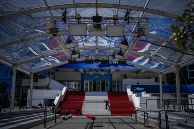 Festival workers prepare the red carpet during preparations for the 77th international film festival, Cannes, southern France, Monday, May 13, 2024. The Cannes film festival runs from May 14 until May 25, 2024. 


