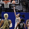 Indiana Fever guard Caitlin Clark (22) scores her first basket against the Connecticut Sun during the second quarter of a WNBA basketball game, Tuesday, May 14, 2024, in Uncasville, Conn. 



