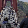 People watch as traffic moves on the Golden Gate Bridge from the Golden Gate Overlook in San Francisco, Friday, May 26, 2023. 



