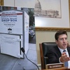 Bryan Steil, R-Wis., chairman of the Committee on House Administration, displays a large photo of an unlocked election ballot drop box in Washington, during a hearing about noncitizen voting in U.S. elections. on Capitol Hill, Thursday, May 16, 2024 in Washington. In recent months, the specter of noncitizens voting in the U.S. has erupted into a leading rallying cry for Republicans. 


