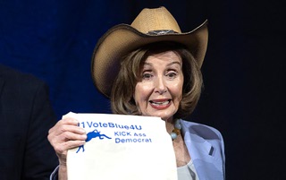 Former Speaker of the House Nancy Pelosi poses with a tote bag after speaking during the Nevada State Democratic Party’s biennial convention at the MGM Grand Conference Center Saturday, May 18, 2024.