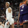 Las Vegas Aces center A'ja Wilson (22) celebrates after scoring against the Phoenix Mercury during the first half of a WNBA basketball game Tuesday, May 14, 2024, in Las Vegas. 