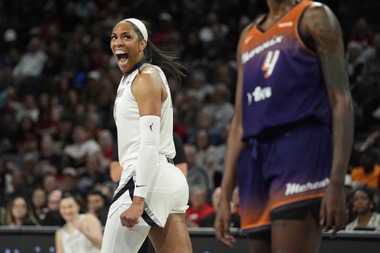 Las Vegas Aces center A’ja Wilson (22) celebrates after scoring against the Phoenix Mercury during the first half of a WNBA basketball game Tuesday, May 14, 2024, in Las Vegas. 