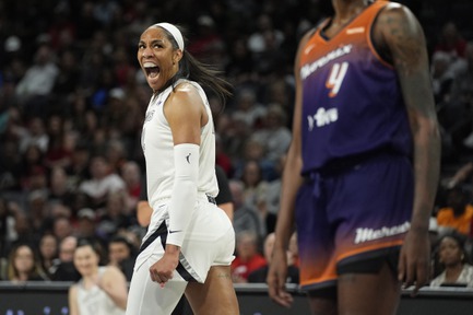 Las Vegas Aces center A'ja Wilson (22) celebrates after scoring against the Phoenix Mercury during the first half of a WNBA basketball game Tuesday, May 14, 2024, in Las Vegas. 