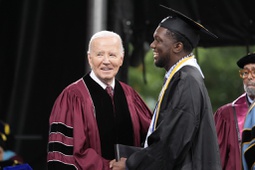 President Joe Biden, left, stands with valedictorian DeAngelo Jeremiah Fletcher at the Morehouse College commencement Sunday, May 19, 2024, in Atlanta.

