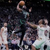 Boston Celtics guard Jaylen Brown (7) drives to the basket against the Cleveland Cavaliers during the second half of Game 5 of an NBA basketball second-round playoff series Wednesday, May 15, 2024, in Boston. The Celtics advanced to the Eastern Conference finals.


