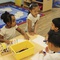 Photo: Children color at the KinderCare Child Development