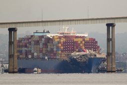Tugboats escort the cargo ship Dali after it was refloated in Baltimore, Monday, May 20, 2024. The container ship that caused the deadly collapse of Baltimore's Francis Scott Key Bridge was refloated Monday and has begun slowly moving back to port.