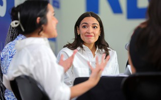 Congresswoman Alexandria Ocasio-Cortez, D-N.Y., listens as Alexis Gonzales Black, left, tells a personal story during a roundtable on women’s reproductive rights at a Biden-Harris field office Thursday, June 20, 2024.