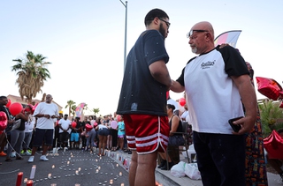 Jalen Simmons, left, brother of murder victim Kayla Harris, gives support to Sal Munoz during a vigil for murder victims outside the Craig Ranch Villas apartment complex in North Las Vegas Wednesday, June 26, 2024. Munoz lost three members of his family in the shooting on Monday. Five people were killed and a 13-year-old girl remained hospitalized with life-threatening wounds, police said.
