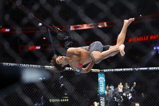 Payton Talbott performs a flip in The Octagon after his first-round knockout victory over Yanis Ghemmouri in a bantamweight fight during UFC 303 Saturday, June 29, 2024.