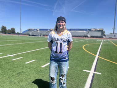 The middle school flag football team needed a quarterback, so the coach lined all the girls up and had them throw the ball.