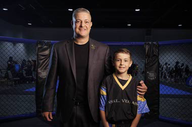 Nick Kalikas, left, owner of the Nevada Sport Karate League and Noah Kalikas, 10, World Kickboxing and Karate Union competitor for the USA Team, pose for a photo during Battle of Las Vegas International Martial Arts Championships at World Market Center Saturday, May 23, 2026.