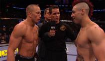 Shane Carwin nabs the interim heavyweight belt after his KO of Frank Mir in the first round, while Georges St. Pierre maintains his welterweight title.